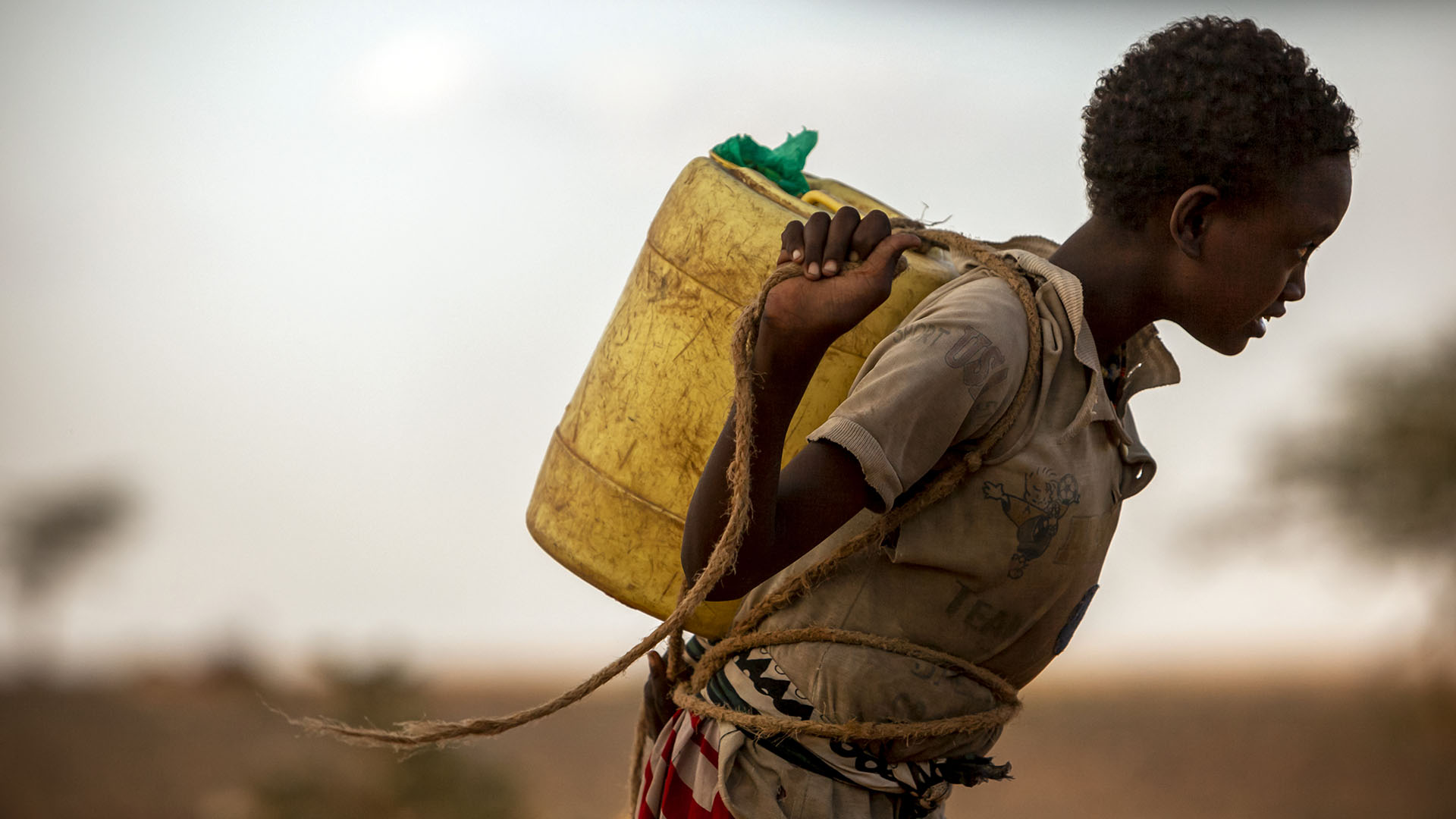 A Rendille child in Kargi, Kenya, carries water from a well recently renovated by Send Relief.