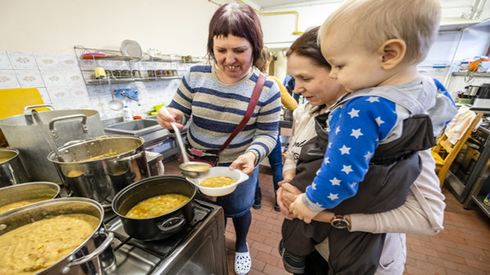 A volunteer serves soup to an Ukrainian refugee at the Baptist Church of Chelms, Poland. The church's members and volunteers from the small town near a Ukraine border crossing have rallied to provide food, hot meals and showers, clothing and beds to the hundreds of thousands of refugees fleeing the war-torn nation. In Feb. 2022, Russian forces invaded Ukraine causing a massive movement of refugees into bordering nations as well as Internally displaced peoples within. IMB Photo