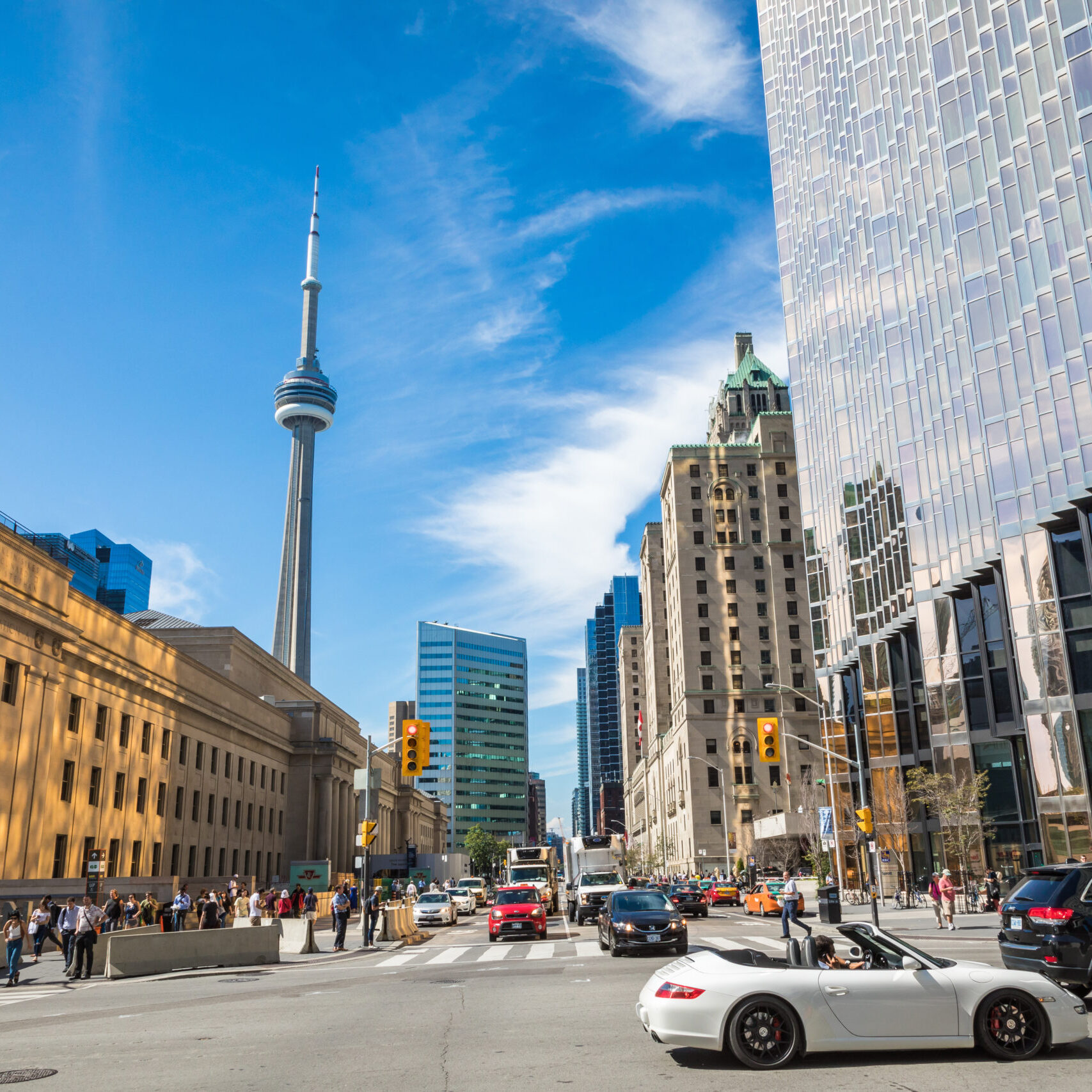 TORONTO, CANADA - SEPTEMBER 17, 2018: Rush hour atToronto's busiest intersections. Financial district at the background.